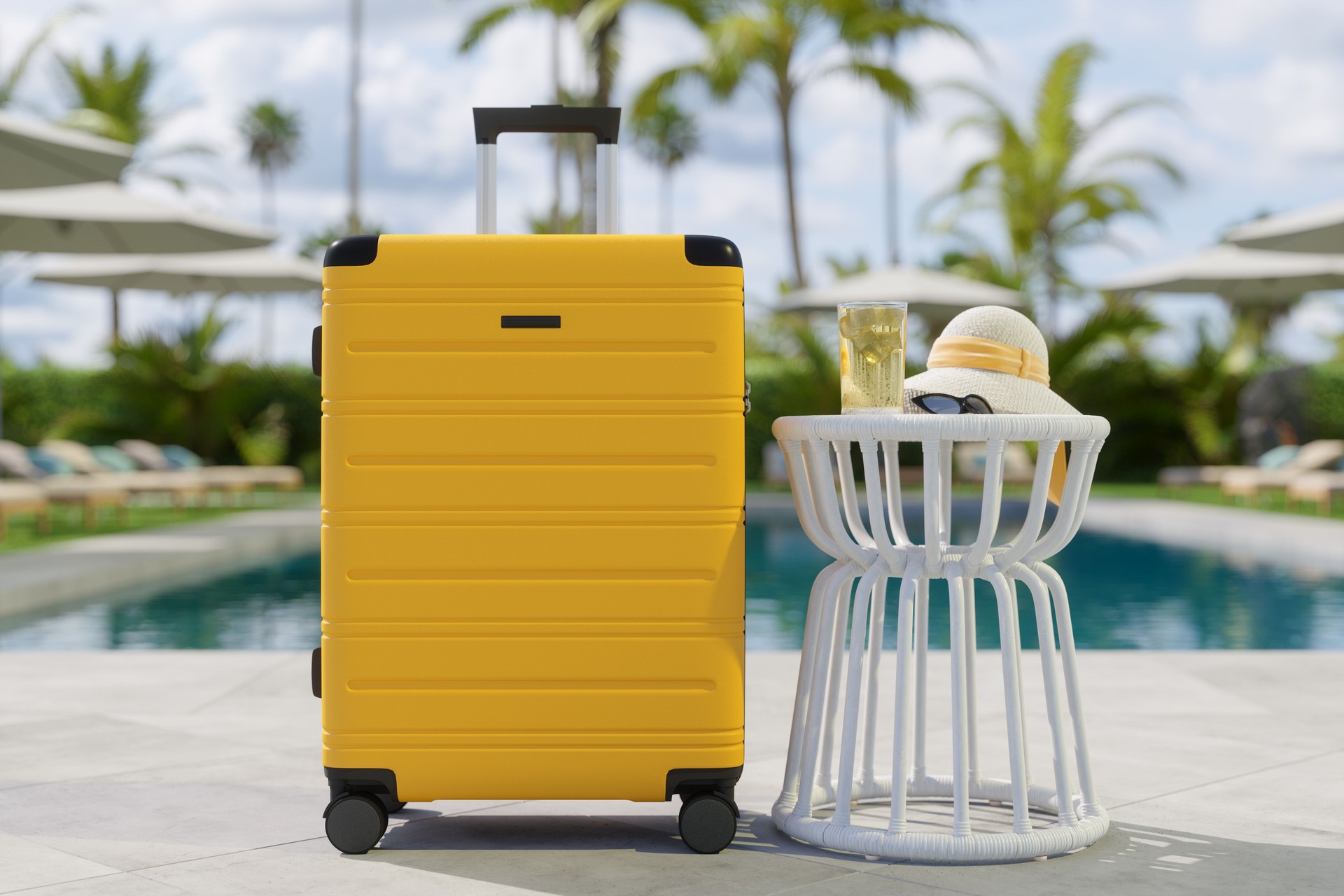 Close-up Of Yellow Luggage, Sun Hat And Cocktail By The Poolside With Blurred Background Close-up Of Yellow Luggage, Sun Hat And Cocktail By The Poolside With Blurred Background